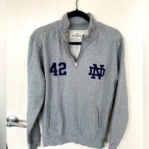 League quarter zip sweatshirt with Notre Dame decal. Size small.